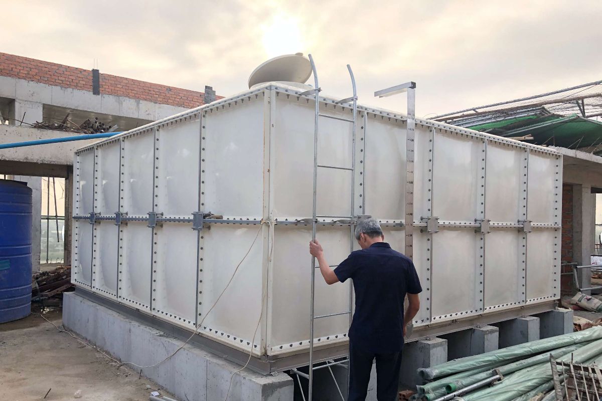 An FRP tank being used outdoors at a industrial facility