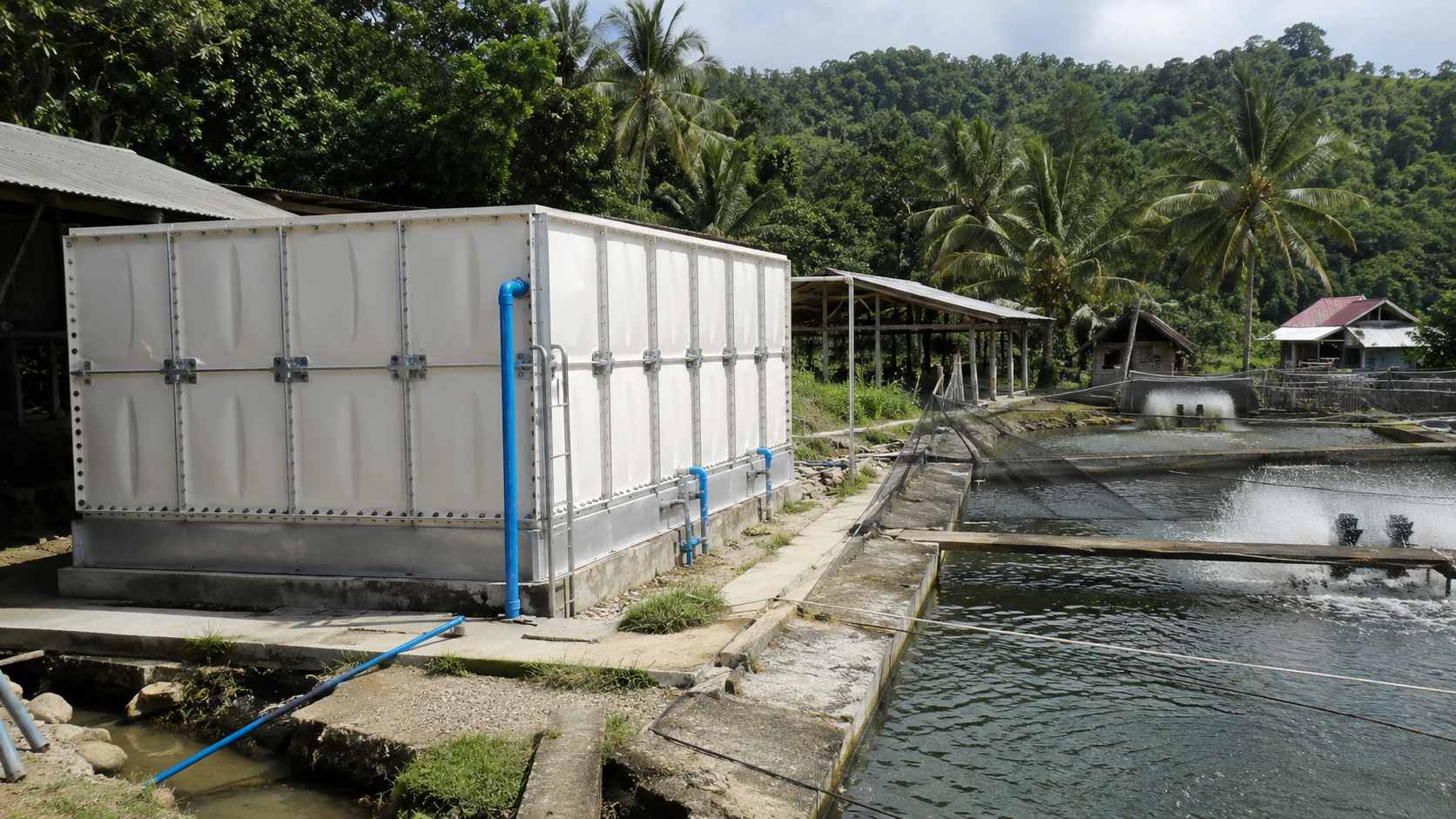 FRP modular water tank used for agriculture and aquaculture water storage beside fish ponds in the Philippines
